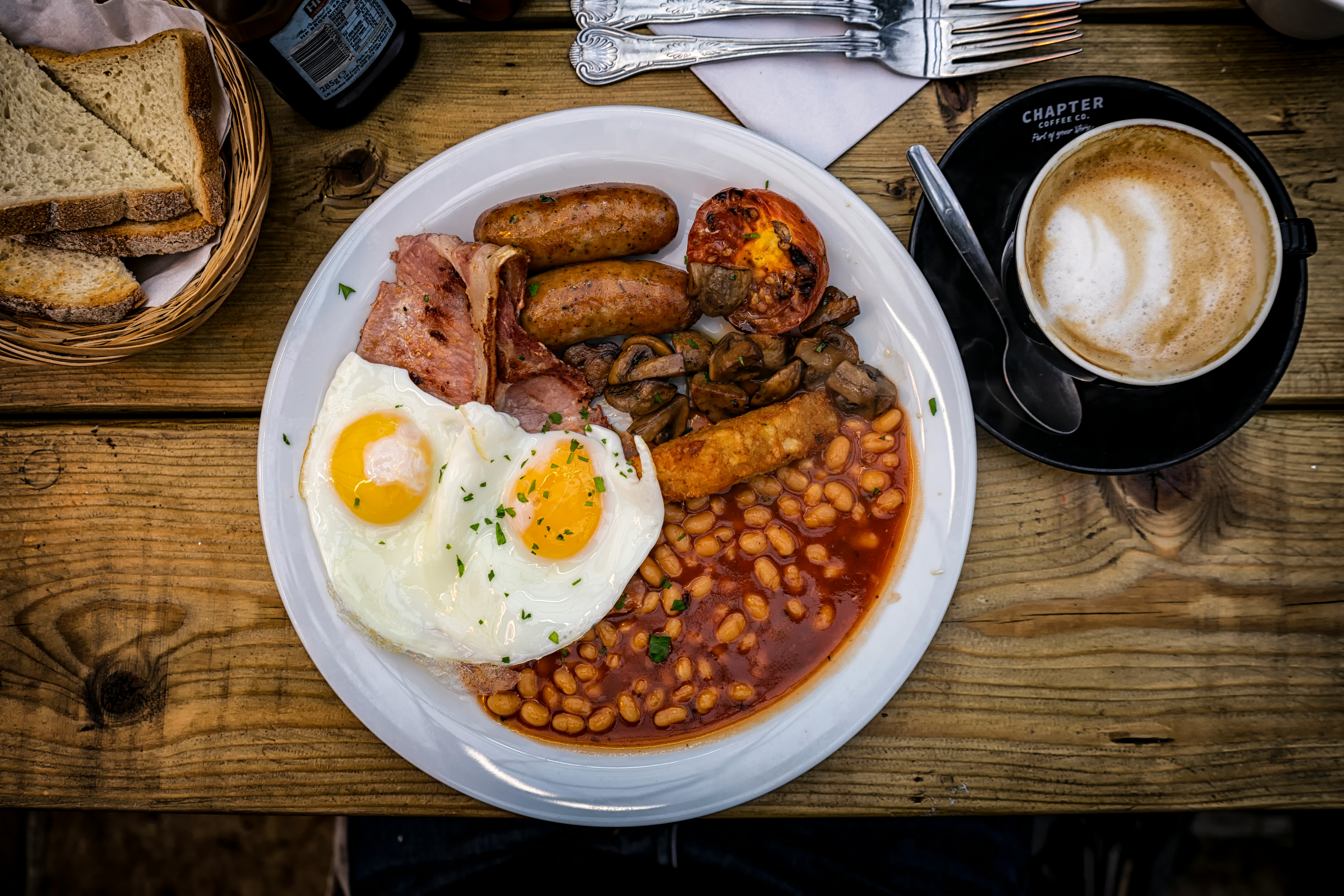 English breakfast with sausages, eggs and beans